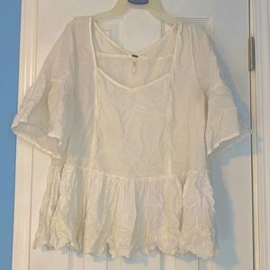 Free people white blouse with lace detailing on the bottom
